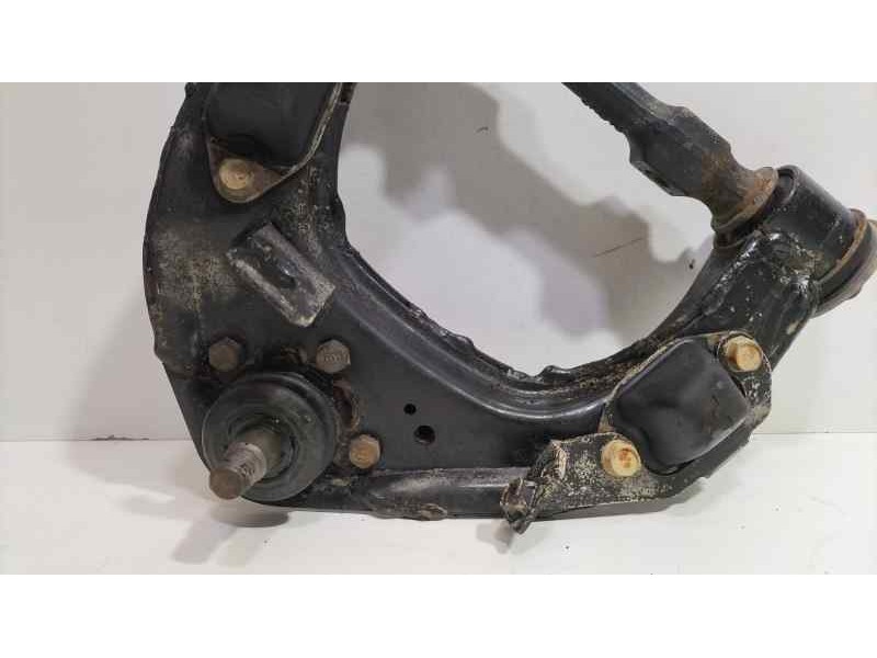 Recambio de brazo suspension superior delantero izquierdo para mitsubishi l 200 (k6/7) 2500 td glx (4-ptas.) referencia OEM IAM 